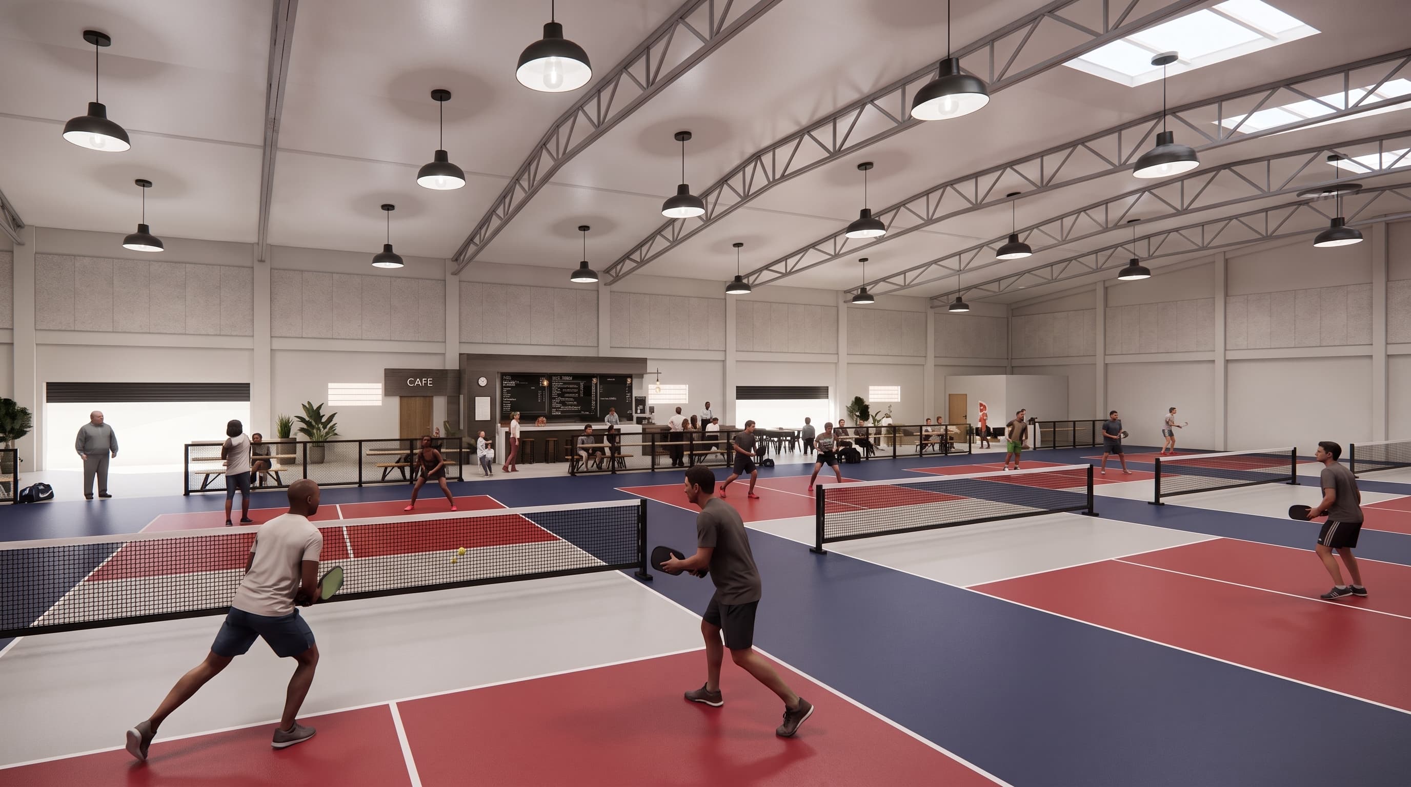 Players in a rally across four indoor pickleball courts